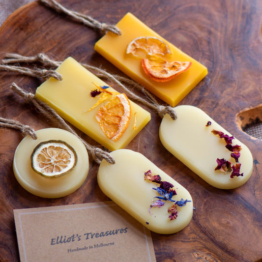 Scented tablet with dried flowers and citrus, handcrafted beeswax tablets for natural fragrance.
